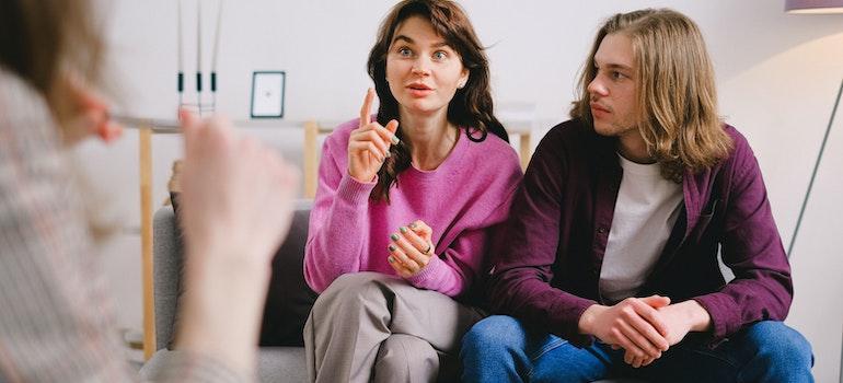 A couple in family therapy for addiction recovery.