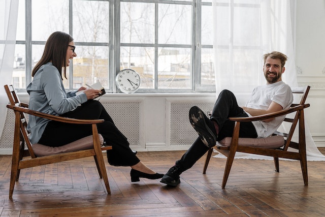 Man laughing with his counselor