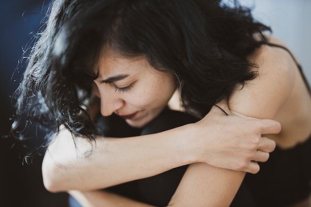 Woman that shows signs of generational trauma.