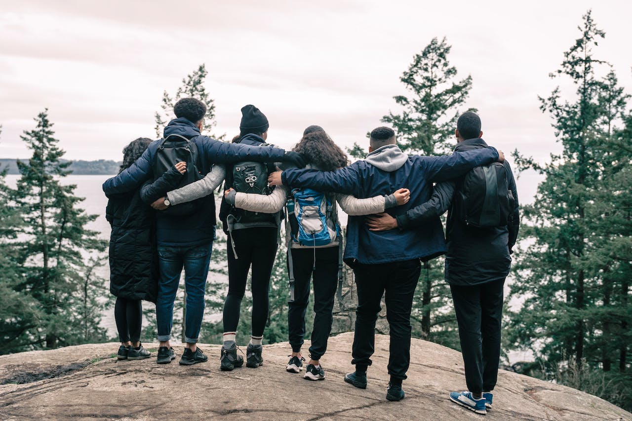 Families dealing with addiction embraced on a hill