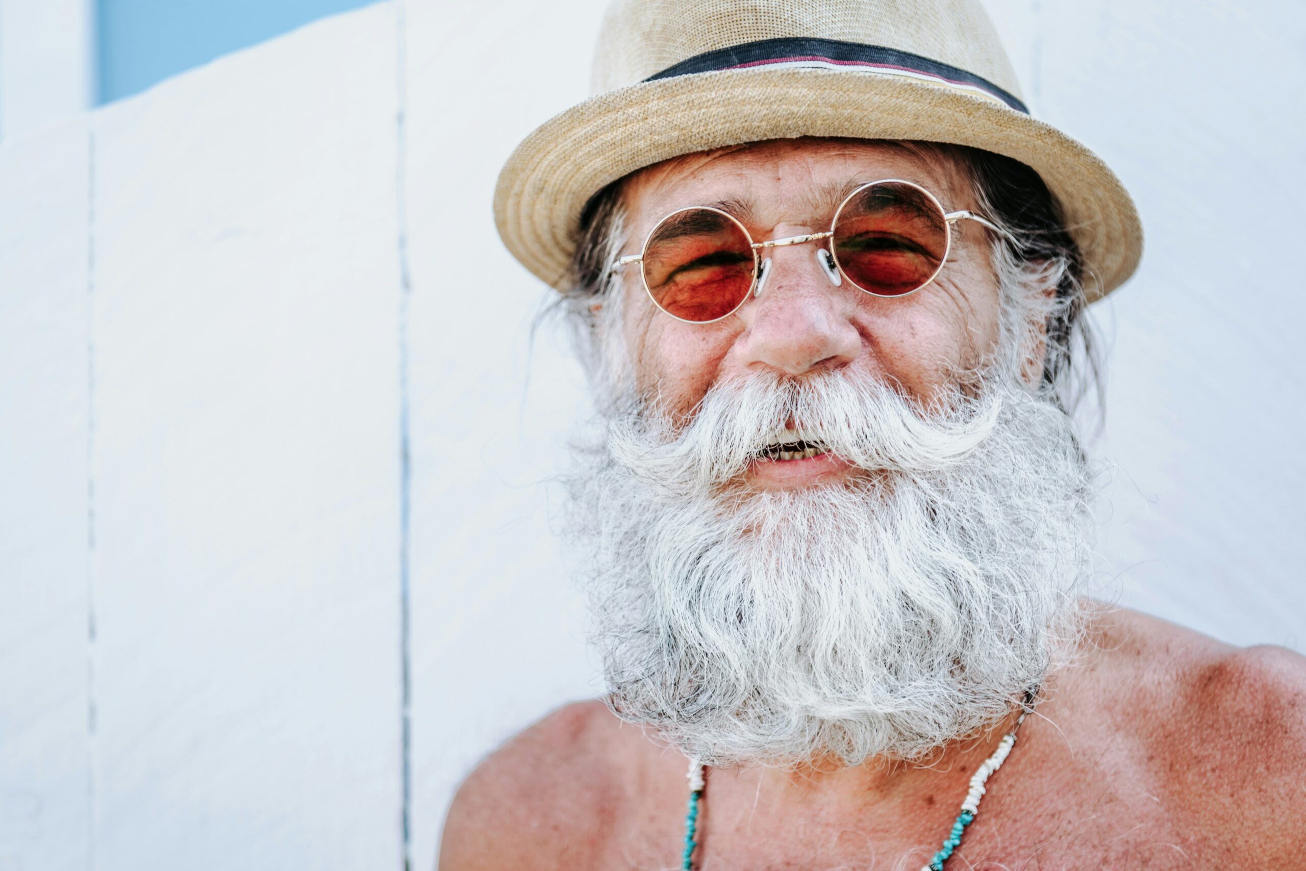A smiling man with a gray beard.