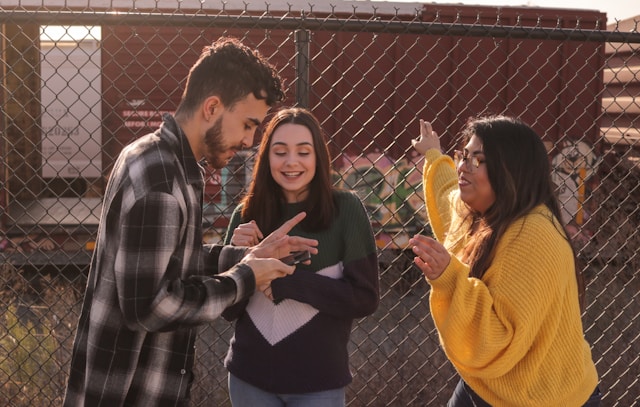 Teens looking at a phone